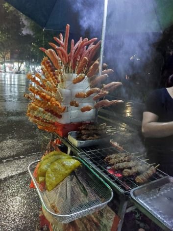 Honai Street Food at night. Xiên Gà / Xiên Heo (Grilled Chicken Or Pork Skewer)