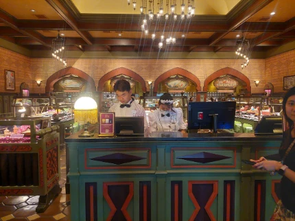 Explorer's club counter with a staff at the back of the desk