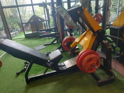 A leg press machine at gym of Indo Serviced Apartment