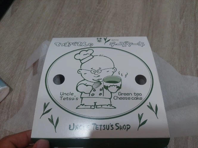 Buying a Matcha cheese cake as a souvenir