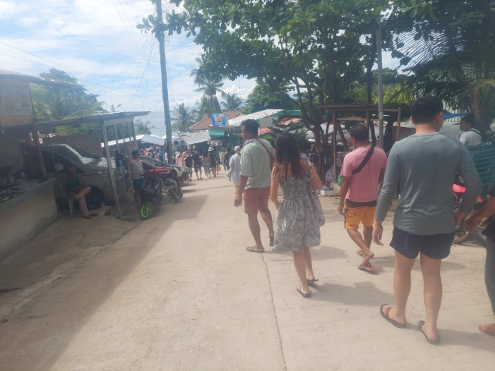 Alley at the whale shark watching site full of shops