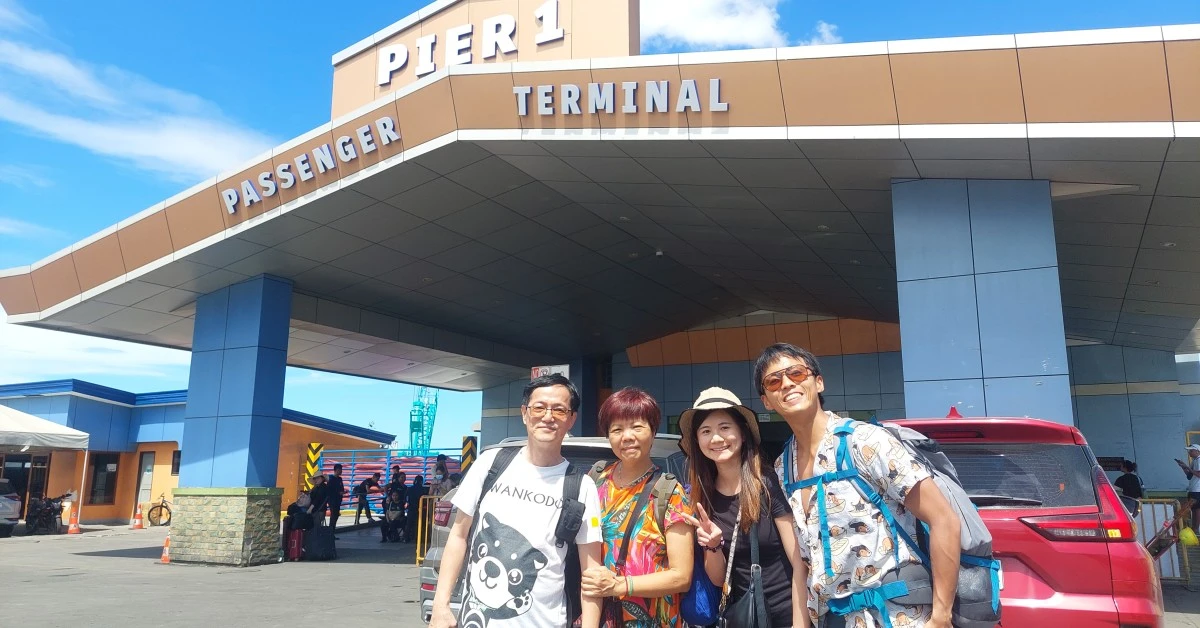 Cebu-Bohol-Ferry-Feature-Page Regulus nad his family taking photo in front of Cebu Pier 1