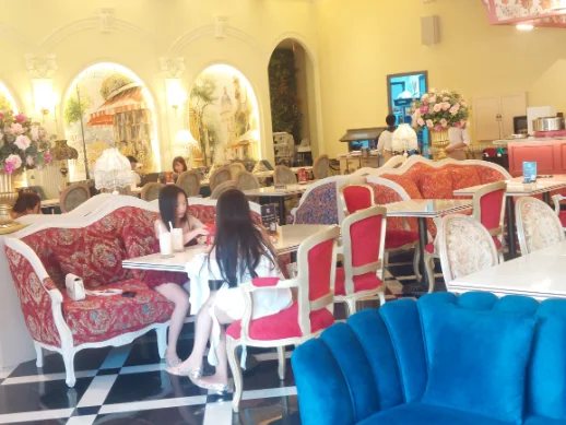 Cozy Cafe Paris with two girls enjoying the drinks