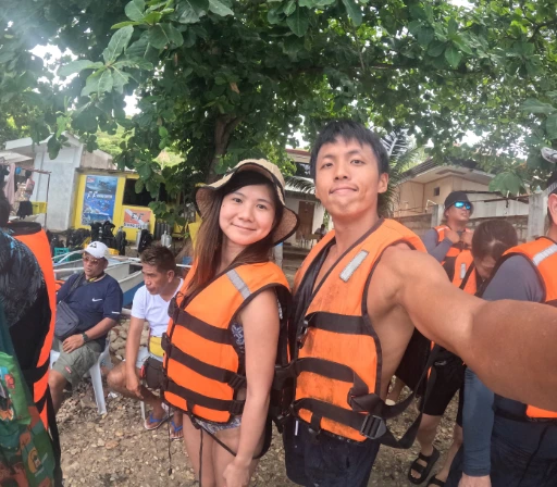 Regulus and his wife taking selfie with life vest on