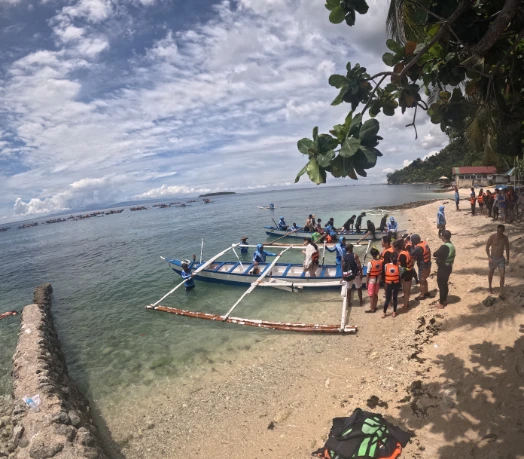 Getting on the boats to whale shark watching area