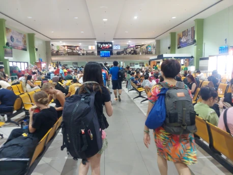 Multiple seats and shops at departure hall