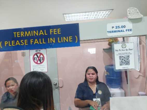 Paying 25 PHP terminal fee before entering departure hall