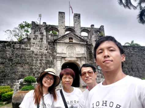 Taking photo in front of Fort San Pedro