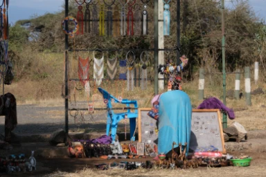A woman tidying her souvenir shop