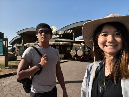 A couple in front of Amboseli Front Gate