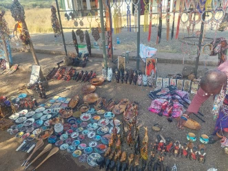 The souvenir shops at the front gate are the cheapest